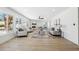 Bright and spacious living room with large windows and a modern fireplace at 9920 Spoonbill E Rd, Bradenton, FL 34209