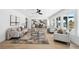 Spacious living room with large windows, open to the dining and kitchen areas at 9920 Spoonbill E Rd, Bradenton, FL 34209