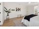 Relaxing bedroom with neutral tones, modern art, and a ceiling fan at 9920 Spoonbill E Rd, Bradenton, FL 34209