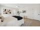 Relaxing bedroom with neutral tones, modern art, and a ceiling fan at 9920 Spoonbill E Rd, Bradenton, FL 34209