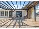 Beautiful outdoor patio with pergola, waterfront views, stylish furniture, and shade at 9920 Spoonbill E Rd, Bradenton, FL 34209