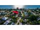 Aerial view of the property close to the beach, marked with a red arrow at 108 5Th St, Belleair Beach, FL 33786