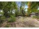 A spacious backyard with lots of potential and lush surrounding greenery, ready for your personal touch at 108 5Th St, Belleair Beach, FL 33786
