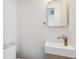 A sleek bathroom featuring a modern sink, vanity, and a minimalist mirror design at 108 5Th St, Belleair Beach, FL 33786