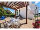 Inviting backyard showcasing a pergola, outdoor dining set, lush greenery, and a well-maintained brick patio at 108 Bermuda Ave, Tampa, FL 33606