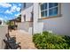 Charming backyard featuring brick pavers, lush greenery, and a pergola with comfortable seating at 108 Bermuda Ave, Tampa, FL 33606