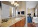 Bathroom vanity with granite countertop and views to an office at 108 Bermuda Ave, Tampa, FL 33606