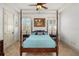 Elegant bedroom with four-poster bed, shutters, and neutral tones creates a serene and inviting atmosphere at 108 Bermuda Ave, Tampa, FL 33606