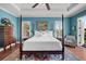 Bedroom featuring a four-poster bed, detailed rug, and a decorative painting at 108 Bermuda Ave, Tampa, FL 33606