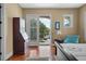 Bright bedroom with hardwood floors and access to a balcony with a water view at 108 Bermuda Ave, Tampa, FL 33606