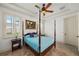 Serene bedroom featuring a four-poster bed, plantation shutters, and a cozy ambiance for restful nights at 108 Bermuda Ave, Tampa, FL 33606