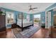This bedroom offers a plush rug, and a balcony with great views of the neighborhood at 108 Bermuda Ave, Tampa, FL 33606