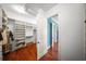 Spacious walk-in closet featuring custom shelving and hardwood floors at 108 Bermuda Ave, Tampa, FL 33606