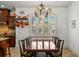 Dining room with window views, chandelier, and a decorative pot rack at 108 Bermuda Ave, Tampa, FL 33606