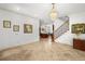 Spacious foyer with tile flooring, staircase, chandelier, and views of the kitchen at 108 Bermuda Ave, Tampa, FL 33606