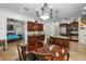 Open kitchen with stainless steel appliances, granite countertops, wine storage, and a breakfast bar at 108 Bermuda Ave, Tampa, FL 33606