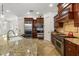 Gourmet kitchen features granite countertops, stainless steel appliances, and custom cabinetry at 108 Bermuda Ave, Tampa, FL 33606