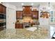 Gourmet kitchen with granite countertops, custom cabinets, and state-of-the-art appliances at 108 Bermuda Ave, Tampa, FL 33606