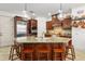 Bright kitchen features a large center island, stainless steel appliances, and beautiful pendant lighting at 108 Bermuda Ave, Tampa, FL 33606