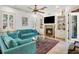 Inviting living room with a brick fireplace, built-in shelving, and comfortable furnishings at 108 Bermuda Ave, Tampa, FL 33606