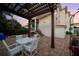 Outdoor patio with pergola, ceiling fan, dining table, and brick paver flooring - great for entertaining at 108 Bermuda Ave, Tampa, FL 33606