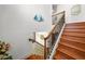 Elegant wooden staircase with wrought iron railings leads to the upper level at 108 Bermuda Ave, Tampa, FL 33606