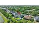 Beautiful aerial view of the home and pool in lush landscaping near a waterway in a lovely neighborhood at 10922 Holly Cone Dr, Riverview, FL 33569