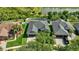 Aerial view of a home with well-maintained landscaping, a pool, and a private backyard at 10922 Holly Cone Dr, Riverview, FL 33569