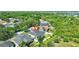 An aerial view shows this home has a large backyard with a screened-in patio at 10922 Holly Cone Dr, Riverview, FL 33569
