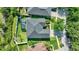 The backyard is surrounded by a privacy fence and has a screened-in patio with a jacuzzi at 10922 Holly Cone Dr, Riverview, FL 33569