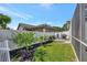 The backyard features a small garden and an outdoor grill with a privacy fence at 10922 Holly Cone Dr, Riverview, FL 33569