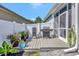 Backyard deck with a modern outdoor grill, perfect for barbecuing and entertaining at 10922 Holly Cone Dr, Riverview, FL 33569