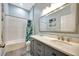 Bathroom with granite vanity, tile floors, bathtub, and shower combination at 10922 Holly Cone Dr, Riverview, FL 33569