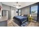 Stylish bedroom with a modern accent wall, soft lighting, and coordinated decor at 10922 Holly Cone Dr, Riverview, FL 33569