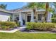 Charming front porch with well-maintained landscaping and a welcoming entrance, perfect for relaxing outdoors at 10922 Holly Cone Dr, Riverview, FL 33569