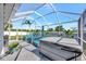 The covered outdoor patio has seating, a spa, a grill and is perfect for entertaining or relaxing at 10922 Holly Cone Dr, Riverview, FL 33569
