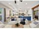 Open-concept living space with a modern kitchen, comfortable seating, and dining area, ideal for entertaining guests at 10922 Holly Cone Dr, Riverview, FL 33569