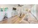 Cozy living room with hardwood floors, comfortable sofa, stylish decor and lots of light at 11035 Huron Rd, St Petersburg, FL 33708