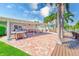 Entertaining covered patio includes barbecue grill, comfortable seating, and access to the waterfront at 11035 Huron Rd, St Petersburg, FL 33708