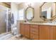 Bathroom with stone countertops and a glass shower enclosure at 111 S Delaware Ave # 1, Tampa, FL 33606