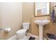 Elegant half bathroom with pedestal sink, decorative mirror, and tiled floor at 111 S Delaware Ave # 1, Tampa, FL 33606