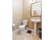 Cozy powder room featuring a pedestal sink and a decorative gold-framed mirror at 111 S Delaware Ave # 1, Tampa, FL 33606