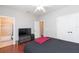 Bedroom with a ceiling fan, tv and bathroom access at 111 S Delaware Ave # 1, Tampa, FL 33606