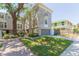 Charming townhouse with a well-kept lawn and inviting brick walkway to the entrance at 111 S Delaware Ave # 1, Tampa, FL 33606