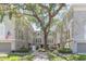 Attractive condos with mature landscaping and a brick-paved courtyard with a large tree in the center at 111 S Delaware Ave # 1, Tampa, FL 33606