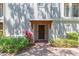 Stylish front door with a decorative awning and lush landscaping enhancing the entrance at 111 S Delaware Ave # 1, Tampa, FL 33606