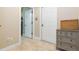 Bright hallway with tile flooring, multiple doors, and a charming side table at 111 S Delaware Ave # 1, Tampa, FL 33606