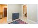 Hallway with a blue dresser between the front door and bathroom at 111 S Delaware Ave # 1, Tampa, FL 33606