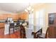 Charming kitchen featuring a dining area, wood cabinets, and stainless steel appliances at 111 S Delaware Ave # 1, Tampa, FL 33606