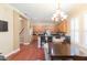 Open kitchen with wood cabinets, granite counters, breakfast bar and modern appliances at 111 S Delaware Ave # 1, Tampa, FL 33606